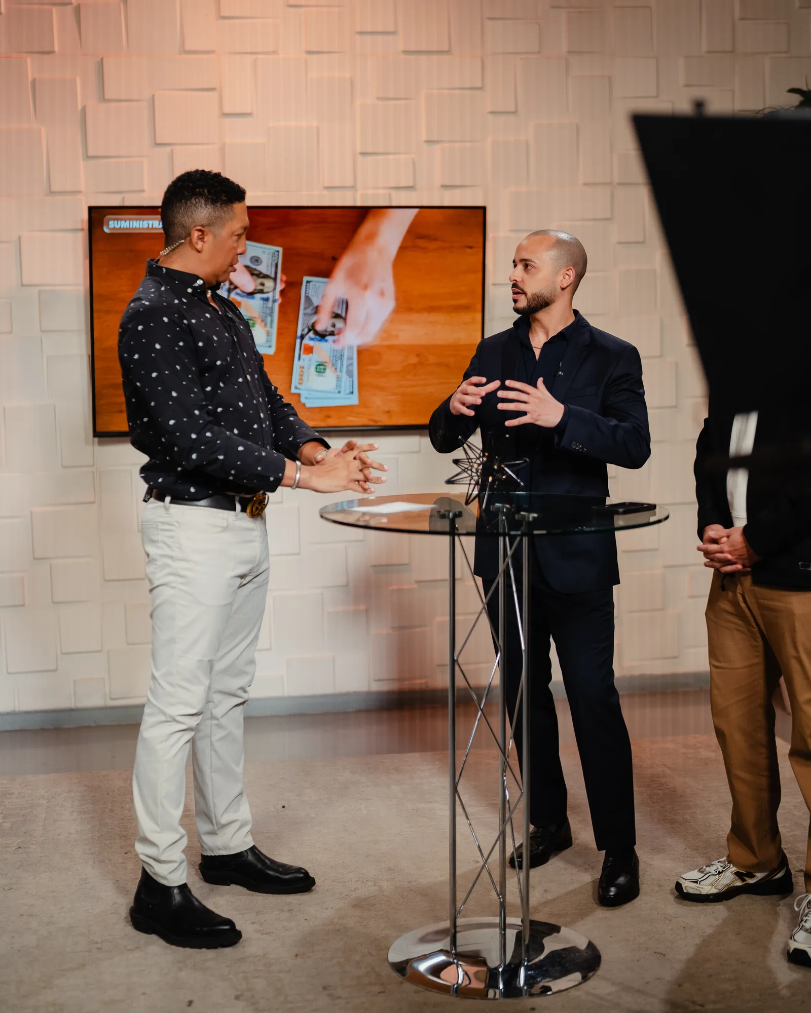 Gabriel explaining something on a TV set